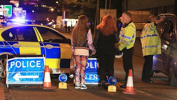 Police at Manchester Arena after reports of an explosion.