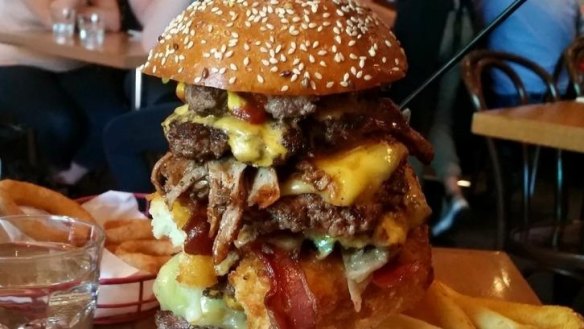 Not on the menu - 11 patties, pulled pork, cheese croquet, bacon, extra cheese layered, onions and pickles in a burger tower - Dandenong Pavilion