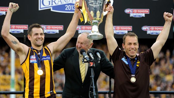 On top of the world: Hawthorn's Luke Hodge, John Kennedy and coach Alastair Clarkson celebrate.