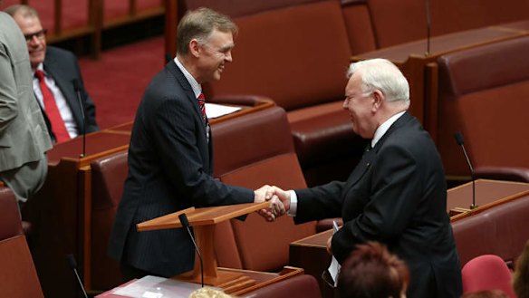Senator Chris Ketter is congratulated by Senator Joe Bullock after delivering his first speech in the Senate. Photo: Alex Ellinghausen
