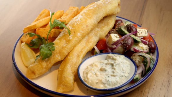 The house fish pack with chips, salad and aioli.