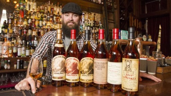 Manager Ryan Lane with a selection of American whiskies at The Gresham.