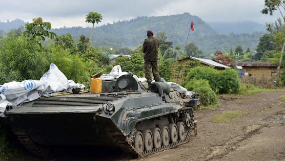 Rebellion over: A Democratic Republic of Congo FARDC regular army soldier looks out at the Mbuzi hilltop in Rutshuru after the army recaptured the area from M23 rebels.