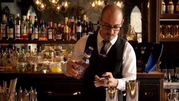 A bartender mixes a Rosetta Sour cocktail at J&M.