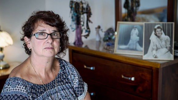 Aged care trainer Bev Myers with a photo of her mother, who lived in aged care.
