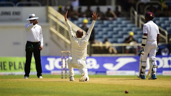 Lyon rampant: Australia's Nathan Lyon successfully appeals for leg-before against West Indies' Darren Bravo on day two of the second Test at Sabina Park, Jamaica.