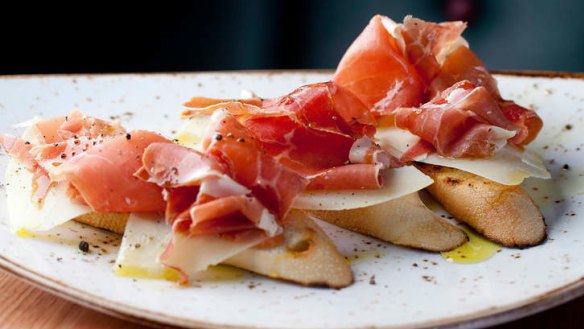 Tomato-rubbed baguette slices topped with jamon and manchego.