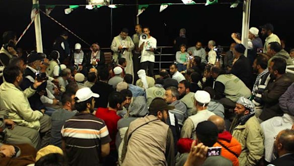 A crowd gathers for a meeting at the stern of the MV Marmara passenger boat, part of the Free Gaza flotilla.