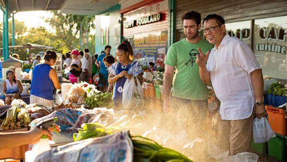 Jimmy Shu (right) and Lynton Tapp explore Darwin's Rapid Creek markets.