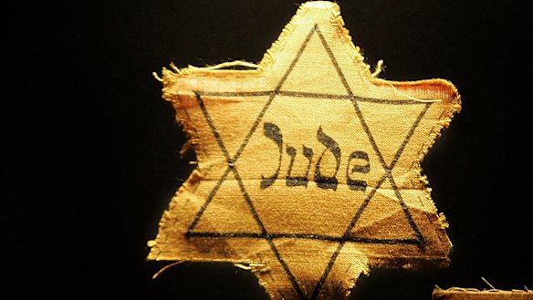 A cloth star with the word 'Jude', German for Jew, that Jews had to wear during the Nazi occupation.