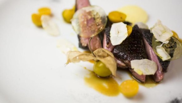Ash-grilled duck, white carrot puree and cape gooseberries served at the Bridge Room.