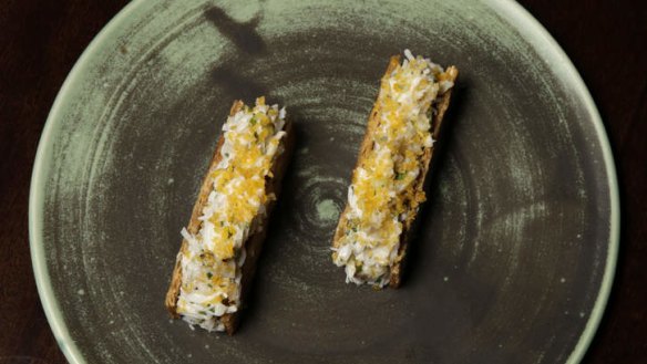 Chicken skin, crab and shaved cured egg yolk.