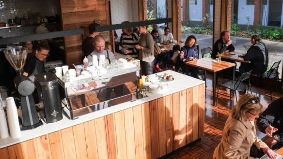 Recycled timbers interiors add warmth to Rough Diamond cafe.