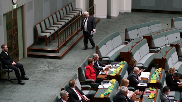 Palmer United Party leader Clive Palmer leaves question time at 2.55 pm on Thursday.