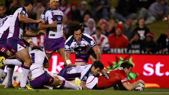 Reaching out ... Brett Morris scores for the Dragons.