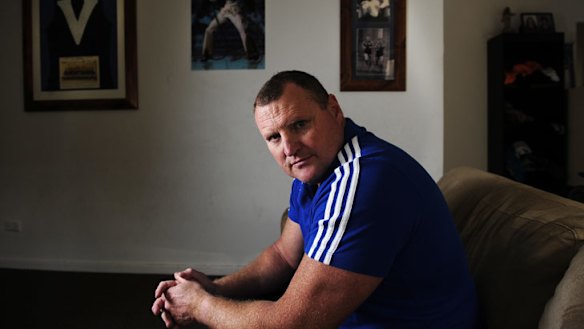 Former Brisbane, Essendon and Melbourne AFL player John Fidge at home in Adelaide.