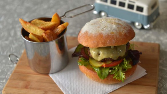 Dakdak burger with hand-cut wedges.