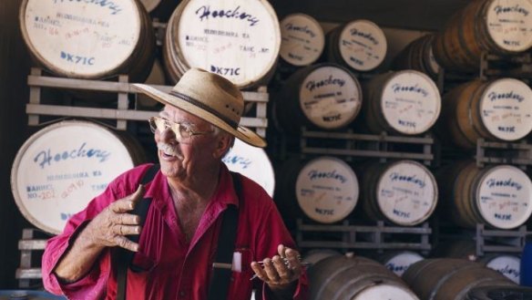 Raymond "Spike" Dessert III with his rum collection.