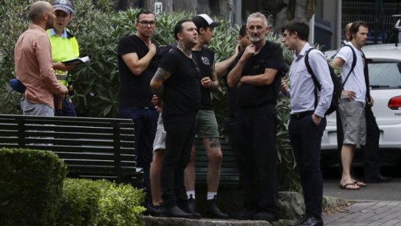 Ben Milgate looks on with his staff outside his restaurant Porteno in Surry Hills.  