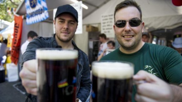 Cheers: Brenton Gersbach and James Brown enjoy the German beer at last year's multicultural festival in Canberra.
