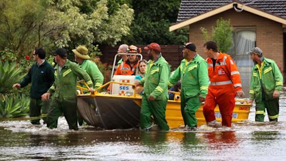 SES volunteers help residents from their flooded homes in Irymple.