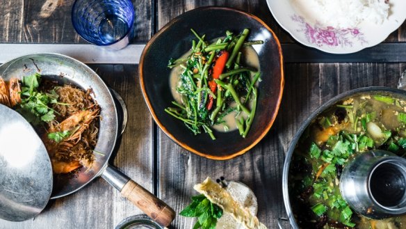 A range of dishes (including greens in fermented yellow bean sauce, centre) at Long Chim.