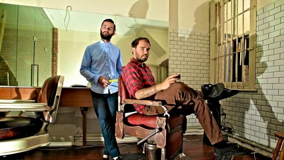 Short black and sides ... barber, Patrick Casey with cafe owner, Harry Levy at their new venture, Cleveland's in Surry Hills.