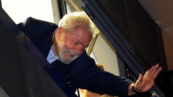 Brazil's former President Luiz Inacio Lula da Silva waves to supporters in front of the metal workers union headquarters in Sao Bernardo do Campo, Brazil.