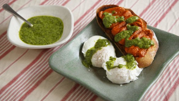 Sobrasada spread on toast with poached eggs and green mojo.