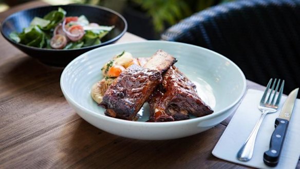 Baby back ribs are smoked in-house.