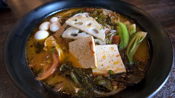 Assorted mushrooms with pickled chilli noodle soup.