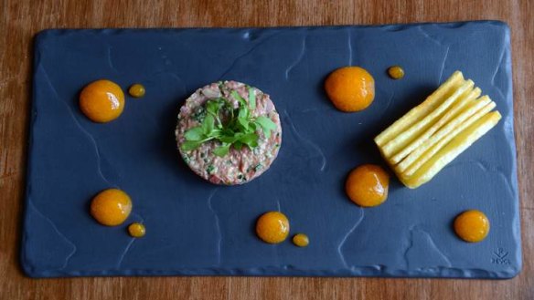 The beef tartare with cooked yolk puree.