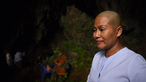 Buddhist nun Dao in the Tham Pra cave shrine where people are praying for the safe return of the trapped 13. 