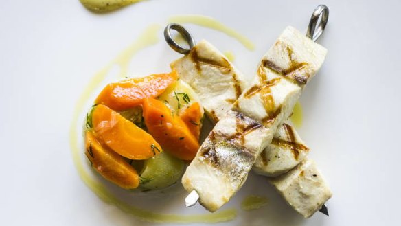 Pretty and subtle: Kingfish skewered, served on braised leeks and carrots.