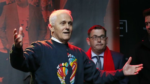 Prime Minister Malcolm Turnbull and Victorian Premier Daniel Andrews arrive for the Long Walk in Melbourne.