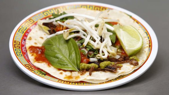 Taco topped with beef and a Mexican-Thai salad mash-up.