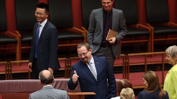 Senator Ricky Muir gives the thumbs up to Senate Leader Eric Abetz after he made his first speech to the Senate in Canberra on Thursday.