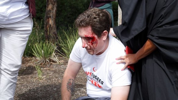 A bleeding right-wing activist outside Sunday's Halal festival. 