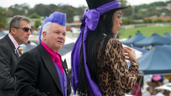 Lyons and his girlfriend Elissa Friday wear colour co-ordinated outfits in the Emirates marquee during Melbourne Cup, 2014.