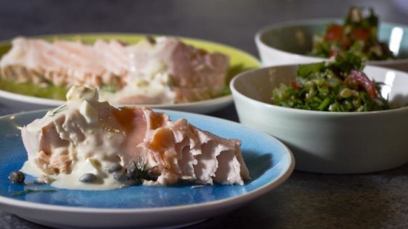 Poached salmon with lemon and caper sauce.