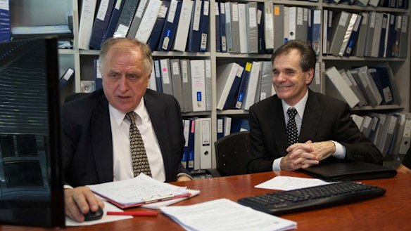 Queensland father Ron Williams (right) and his solicitor Claude Bilinsky react to the High Court ruling today.