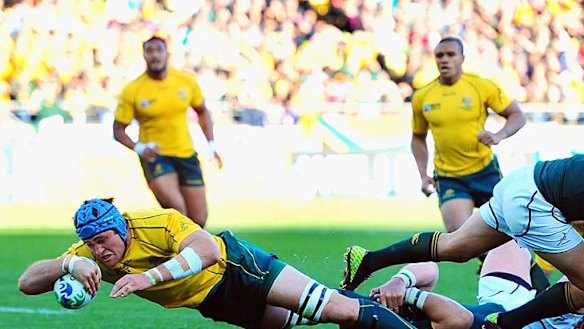 James Horwill of Australia goes over for the only try of the game.