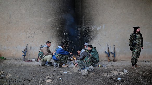 Fighters in Tel Tamer, where IS militants had abducted 220 Assyrians a day before. PHOTO Fadi Yeni Turk