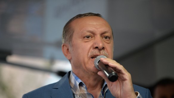 Turkish President Tayyip Erdogan delivers a speech to his supporters in Istanbul after the failed coup.