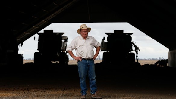 Farmer Michael O'Brien with harvesters he has not used for years because of the drought.