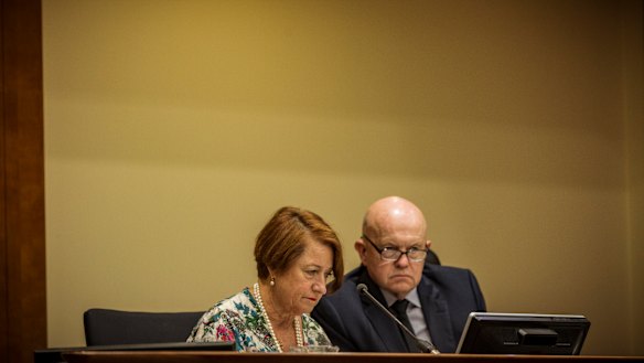 Deputy Chief Magistrate Jelena Popovic looks at the accused's file while journalist John Silvester looks like a hanging judge.  