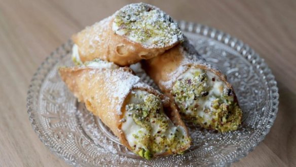Cannoli with sweetened ricotta, candied fruit and pistachios.
