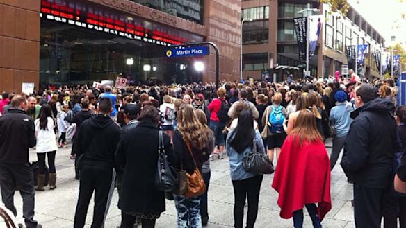 Popular .... fans gather in Martin Place this morning to catch a glimpse of One Direction.