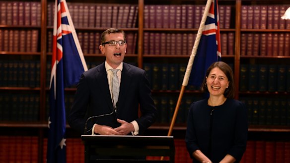 Treasurer Dominic Perrottet, with Premier Gladys Berejiklian, is spearheading the privatisation of Land and Property Information.