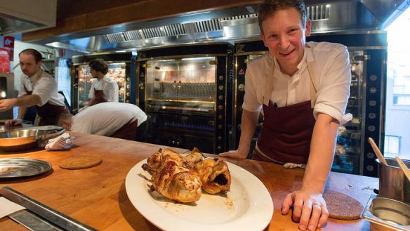 Chef Ben Greeno is on display in the open kitchen, along with his Rotisol rotisseries.